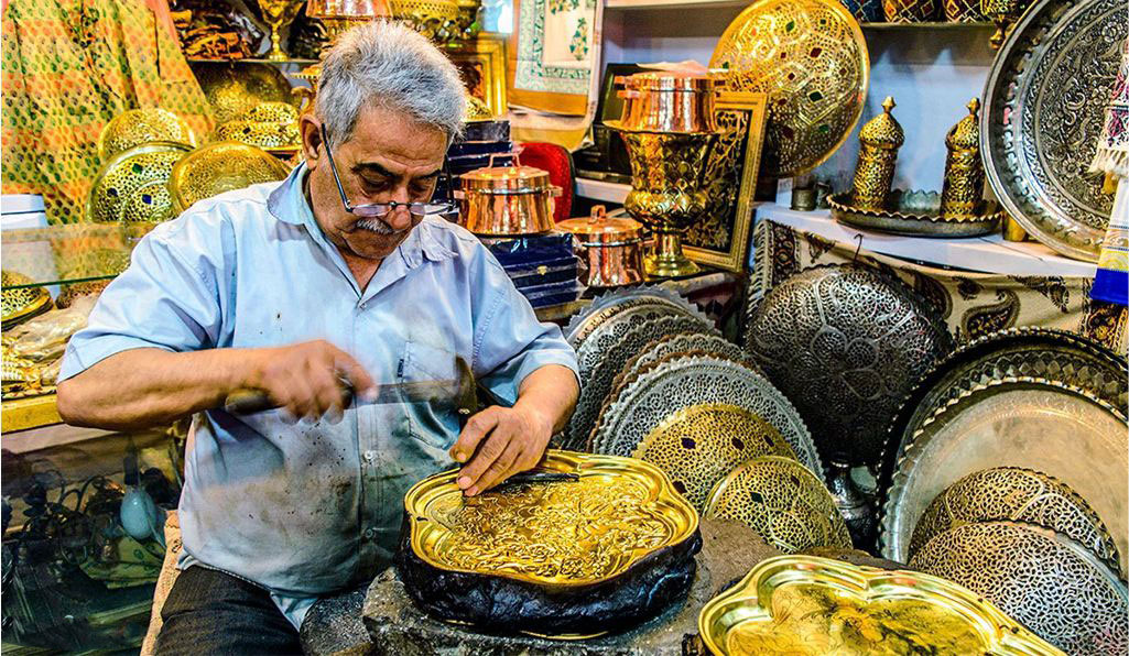 Handicraft workshop in Isfahan showing traditional artisans at work