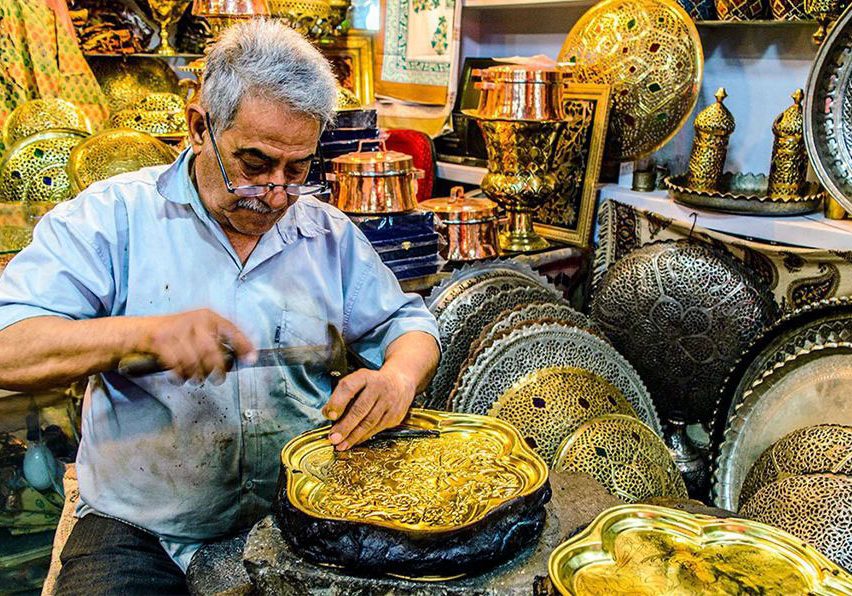 Handicraft workshop in Isfahan showing traditional artisans at work